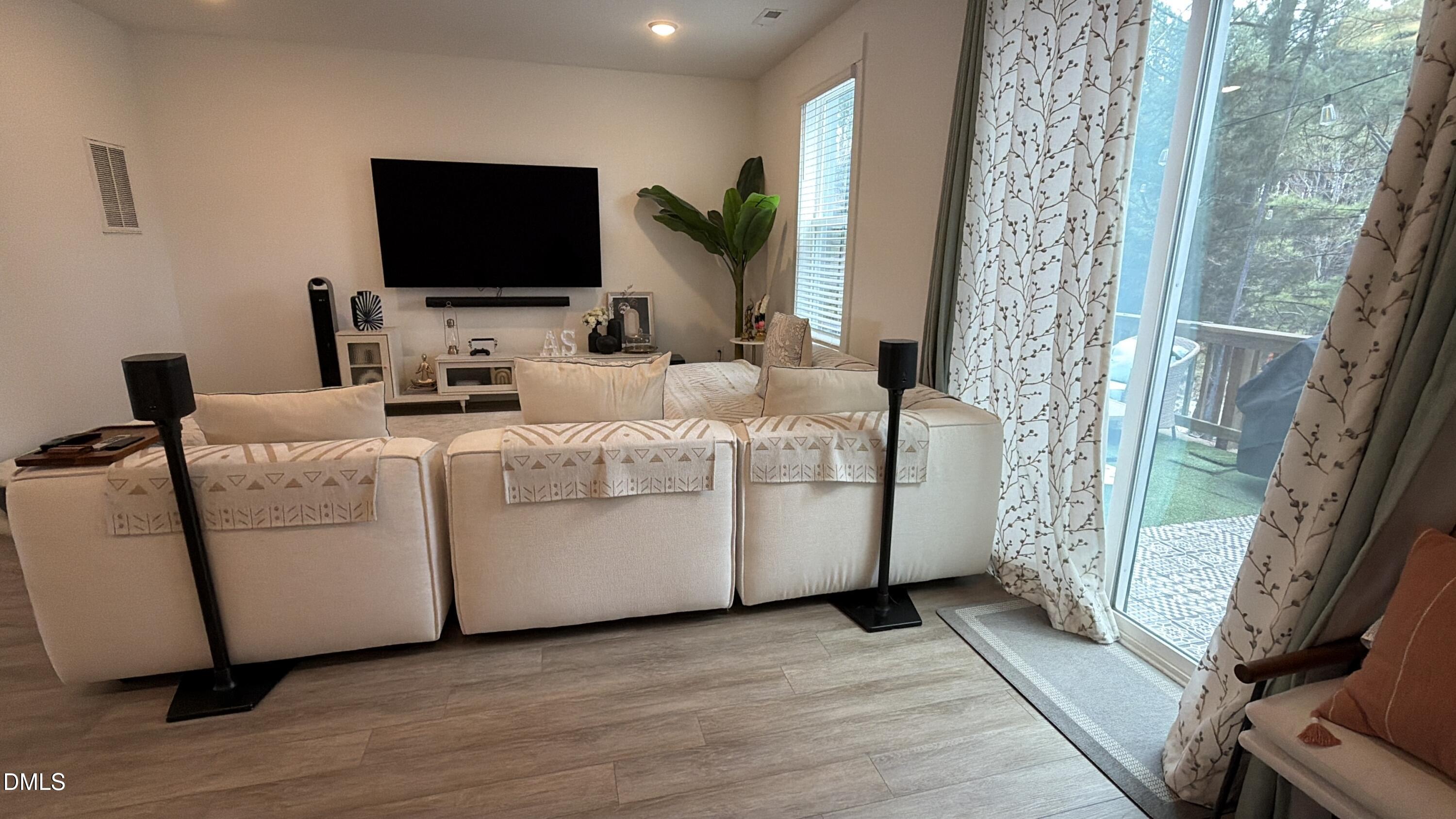 1250 Corkery Ridge Court Cary, NC 27519 - Photo 12 of 31 a living room with furniture and a flat screen tv