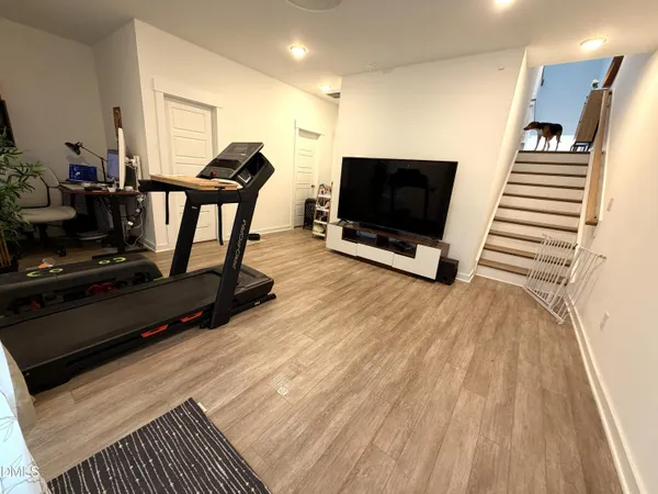 a view of a livingroom with furniture and a flat screen tv