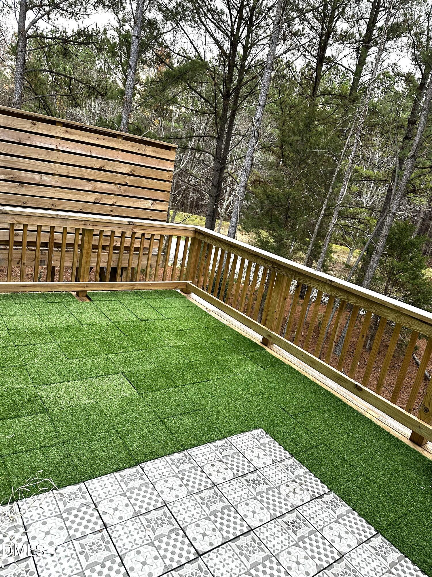 1250 Corkery Ridge Court Cary, NC 27519 - Photo 27 of 31 a view of a deck with a yard