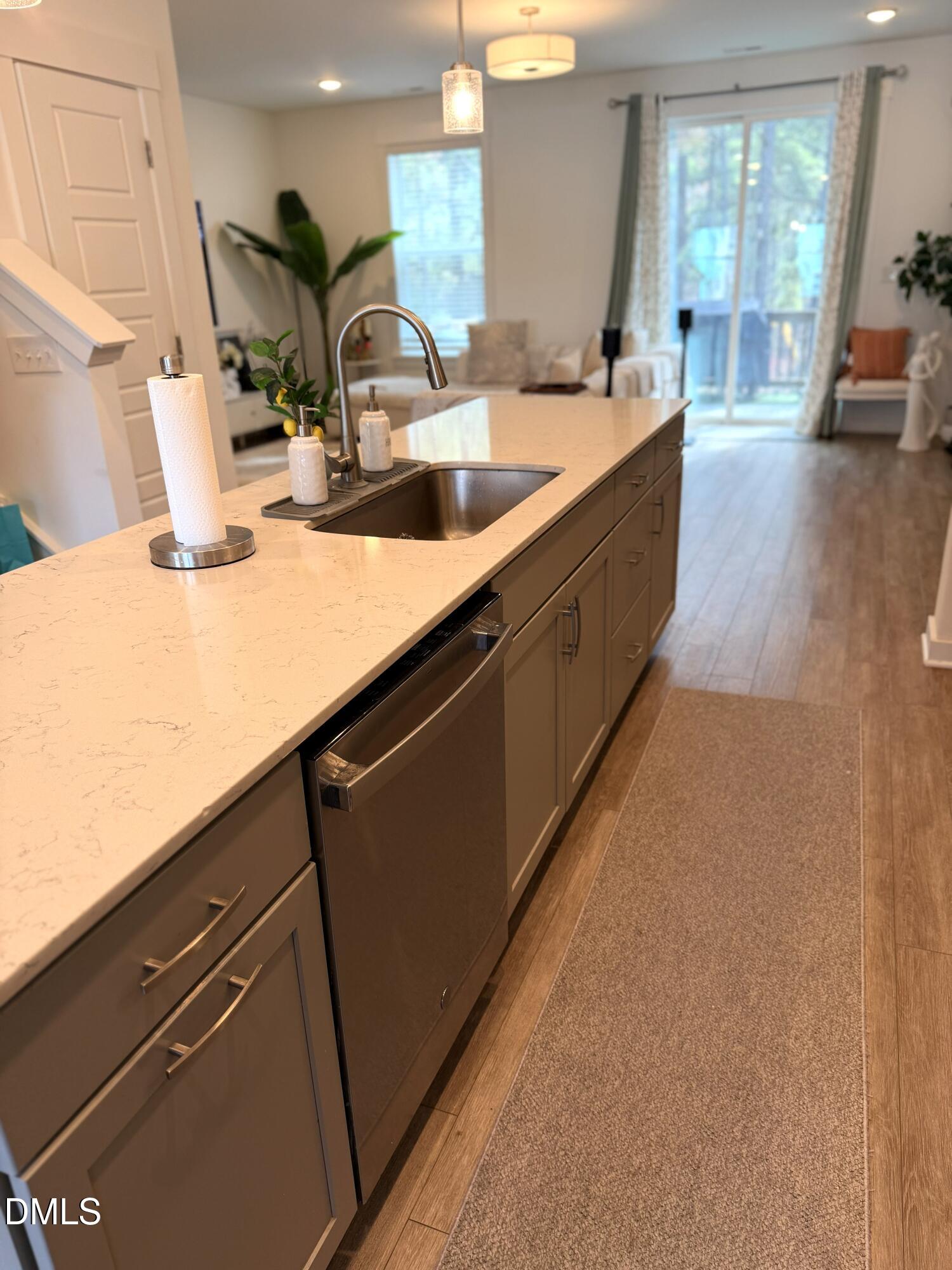 1250 Corkery Ridge Court Cary, NC 27519 - Photo 7 of 31 a kitchen with sink a counter space and cabinets