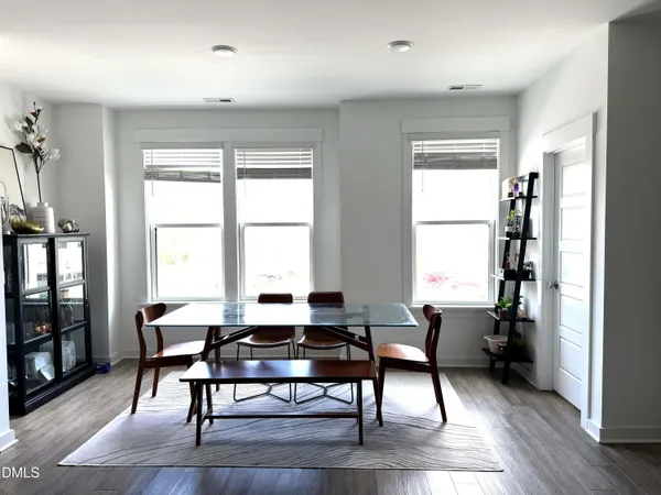 a workspace with wooden floor and a window