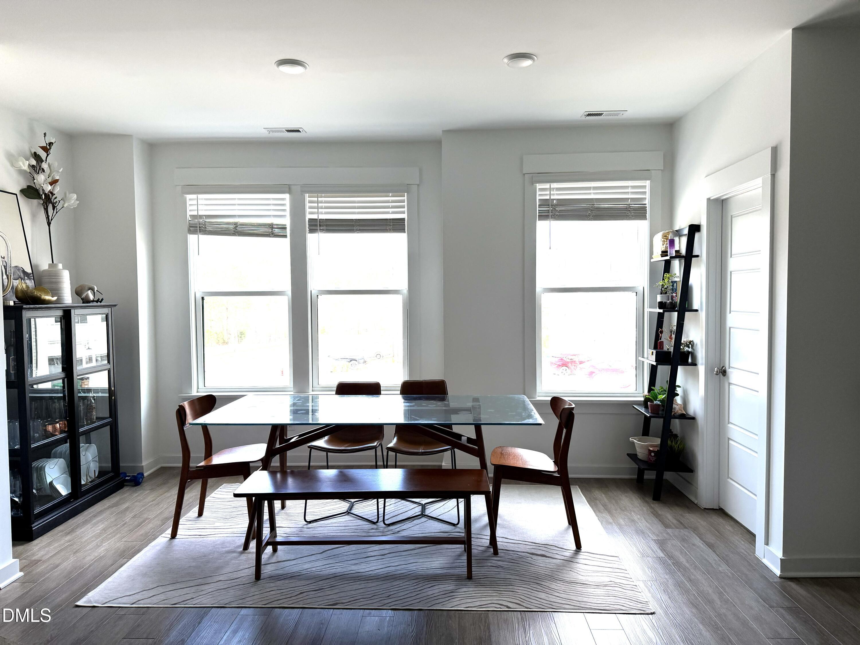 1250 Corkery Ridge Court Cary, NC 27519 - Photo 8 of 31 a workspace with wooden floor and a window