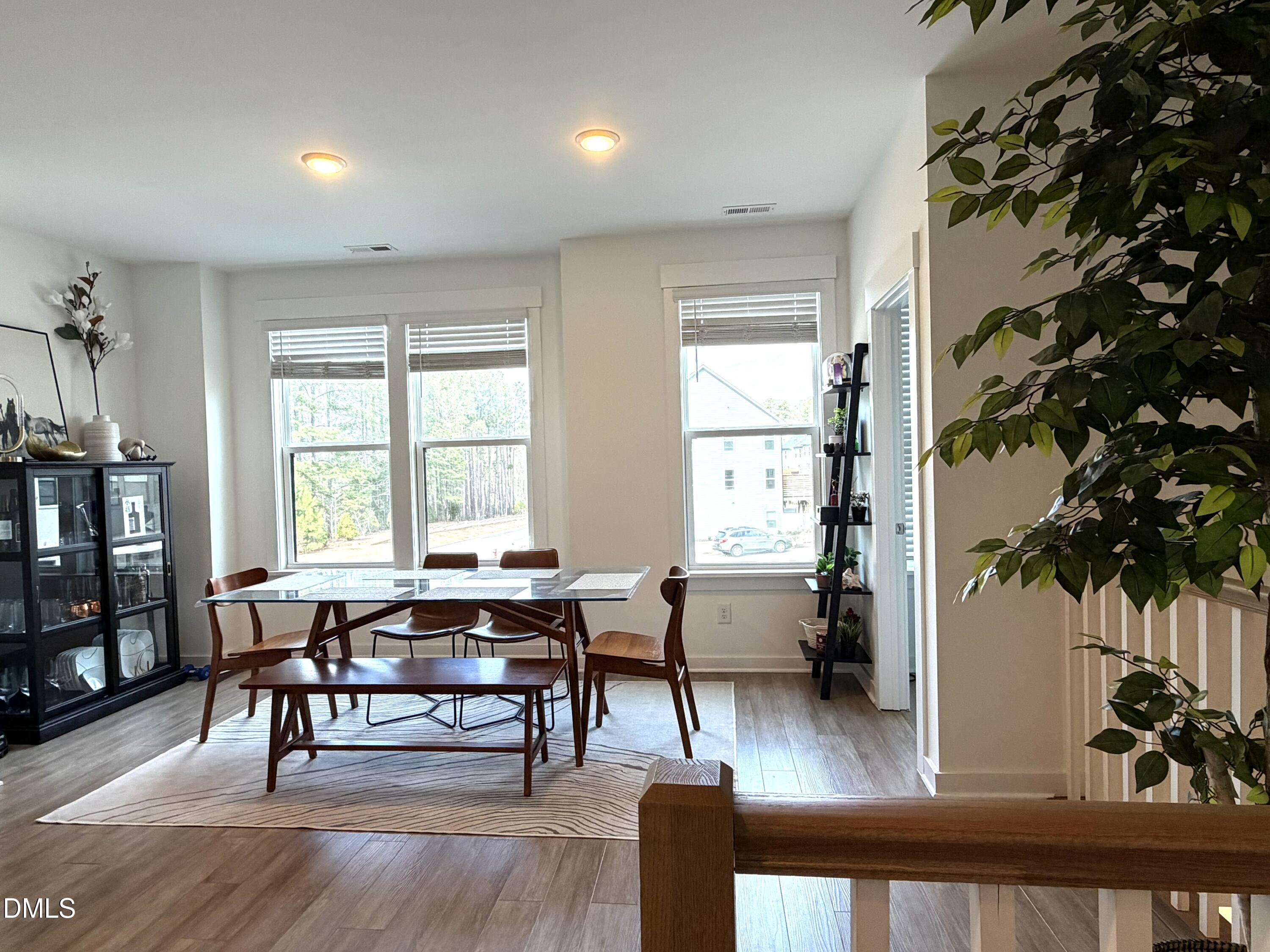 1250 Corkery Ridge Court Cary, NC 27519 - Photo 9 of 31 a view of a dining room with furniture window and wooden floor