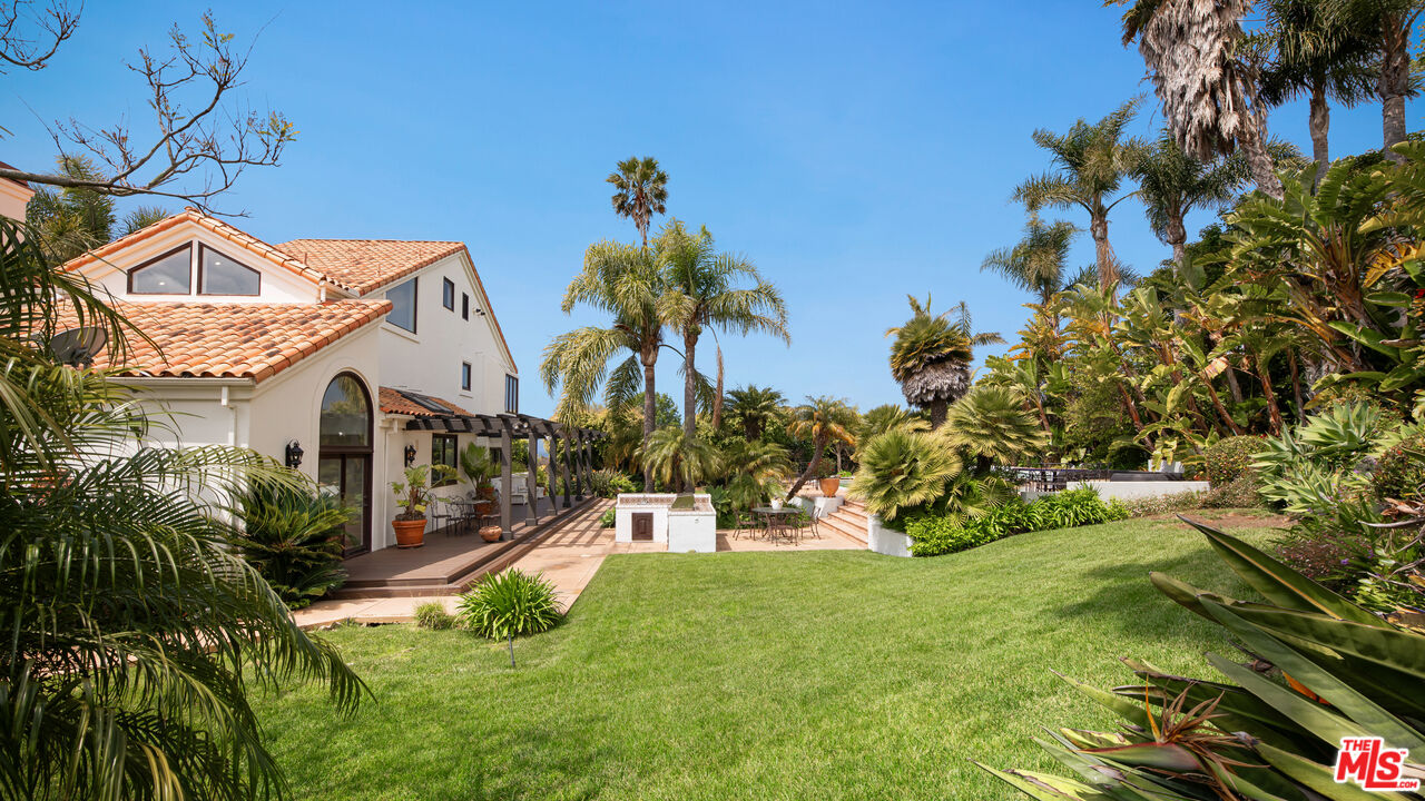 29675 Harvester Road Malibu, CA 90265 - Photo 27 of 36 a view of a house with a yard