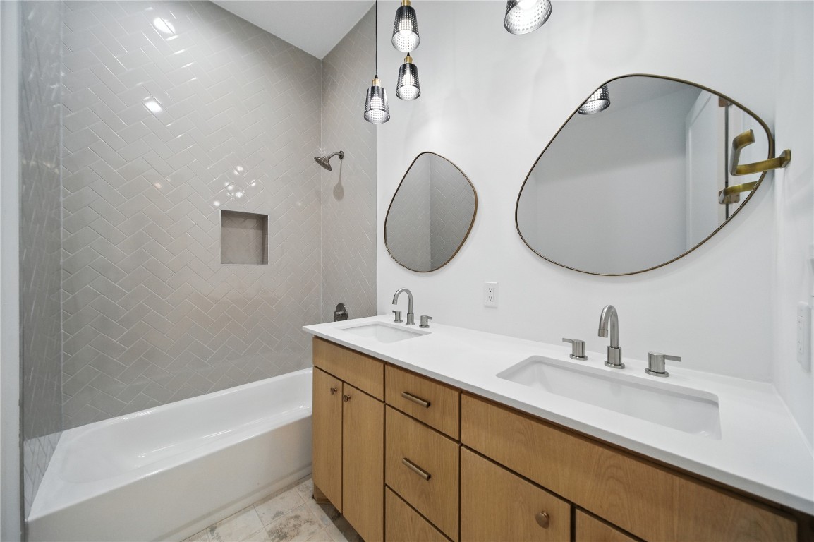 106 West Croslin Street, Unit B Austin, TX 78752 - Photo 12 of 23 a bathroom with a sink and a mirror