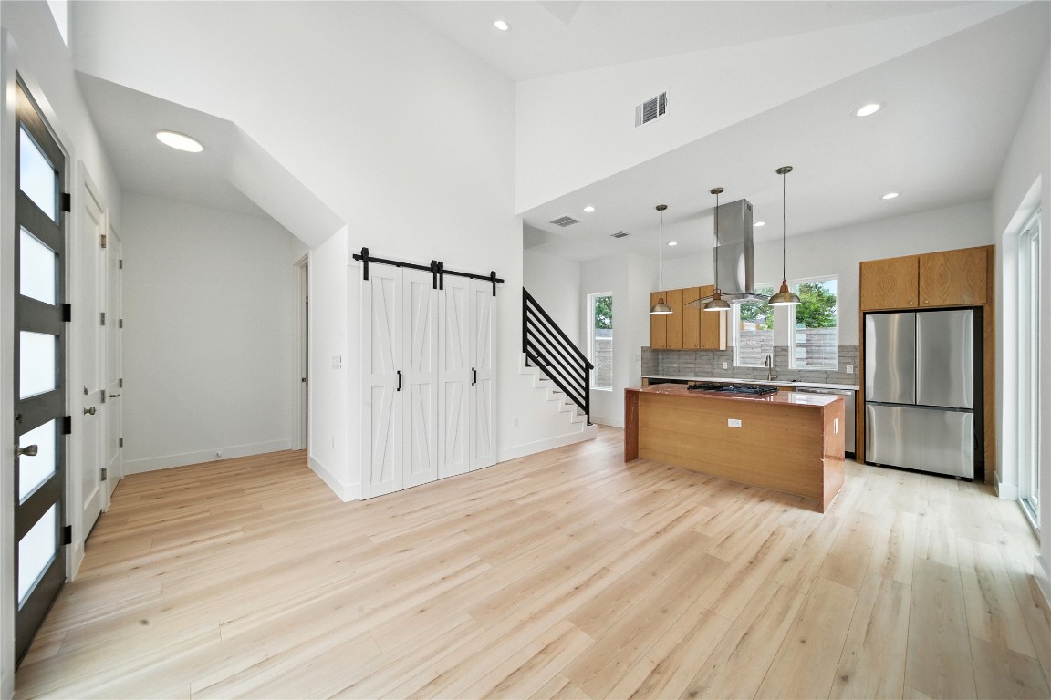 106 West Croslin Street, Unit B Austin, TX 78752 - Photo 23 of 23 a view of kitchen and hall with wooden floor