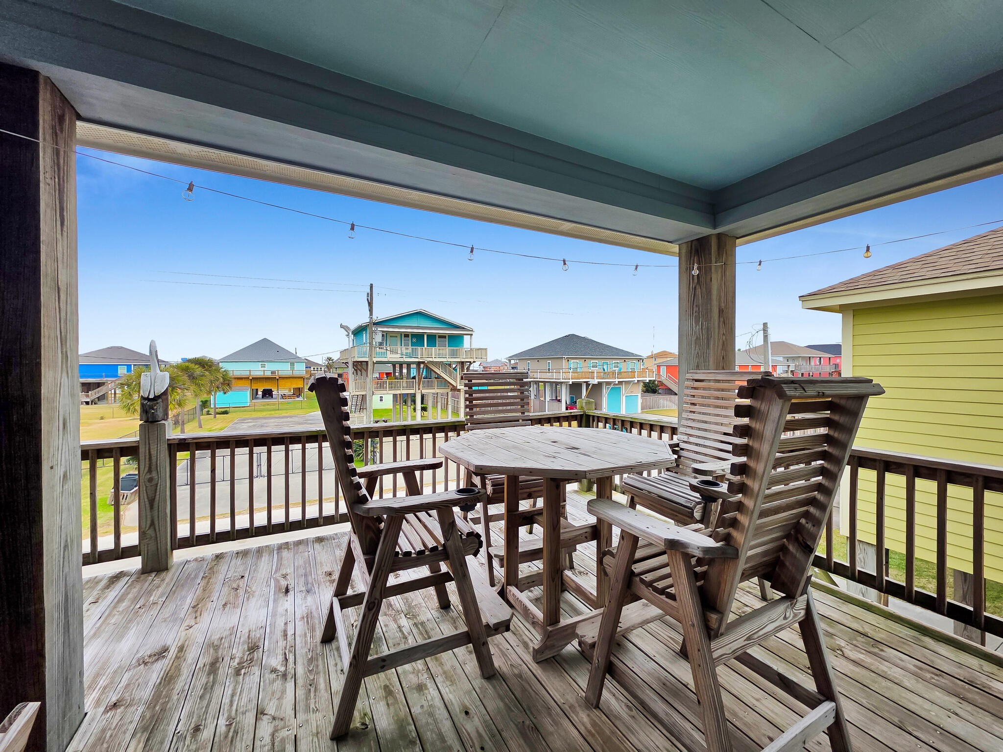 857 Wommack Crystal Beach, TX 77650 - Photo 14 of 46 a view of a chairs and table on the deck