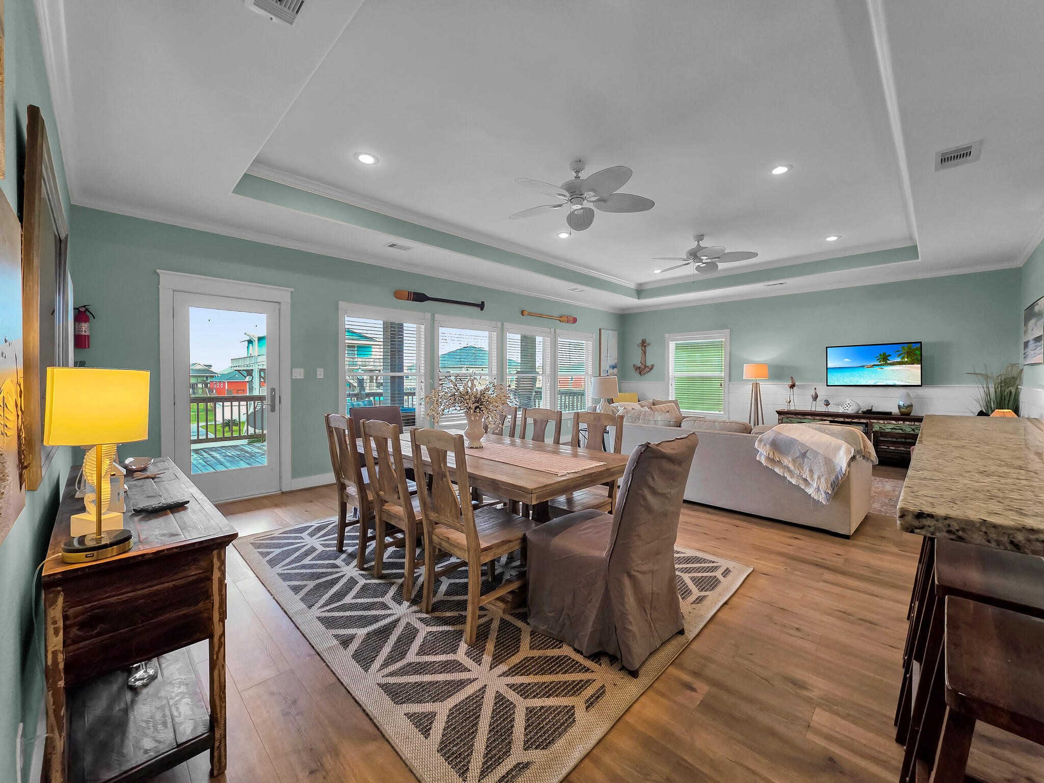857 Wommack Crystal Beach, TX 77650 - Photo 19 of 46 a view of a dining room with furniture and wooden floor