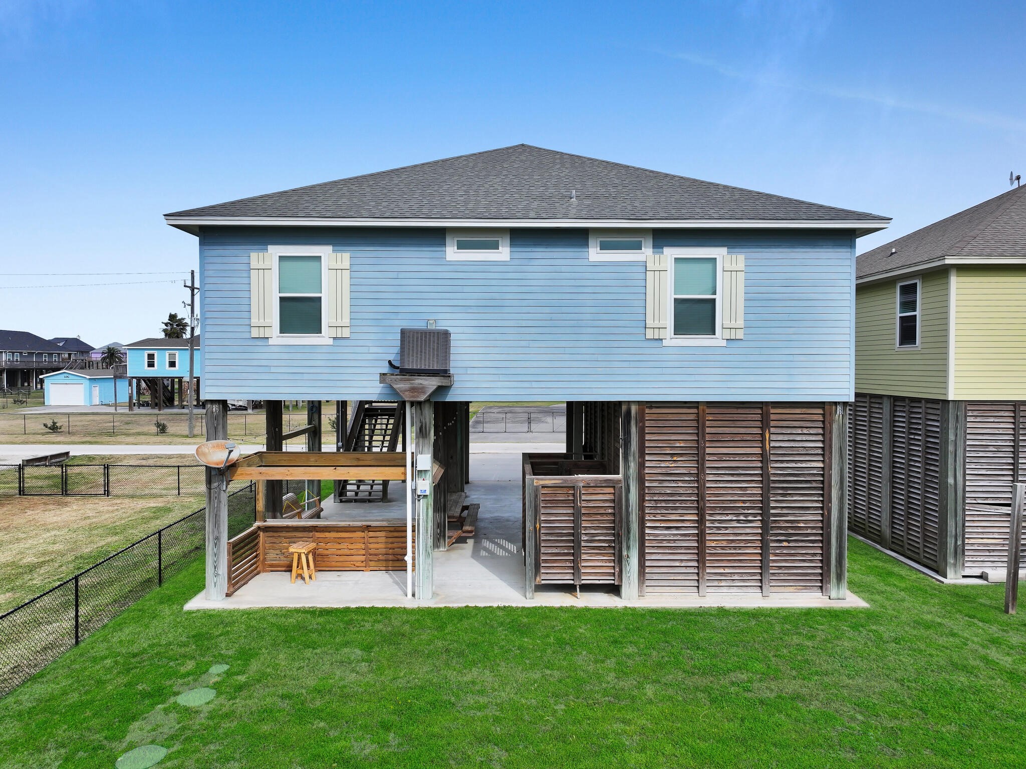 857 Wommack Crystal Beach, TX 77650 - Photo 8 of 46 a view of a house with a backyard