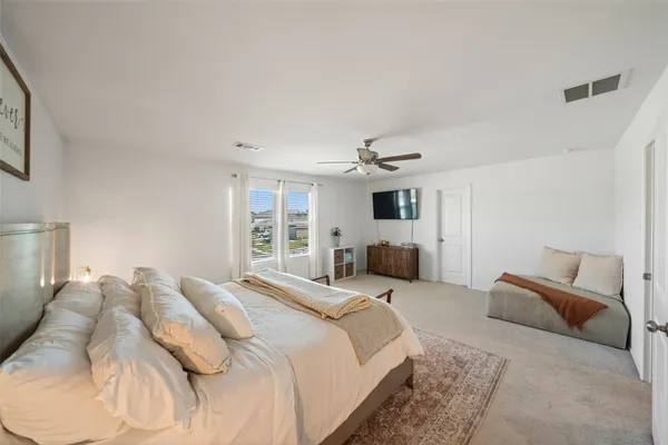 a large white bed in a white room