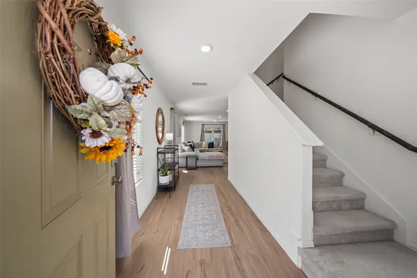 a view of a hallway view with staircase