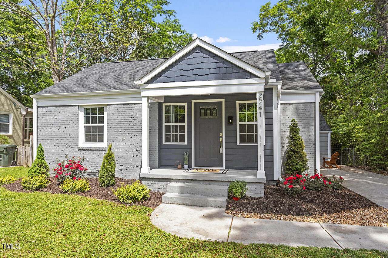 2241 Sheffield Road Raleigh, NC 27610 - Photo 1 of 33 a front view of a house with garden