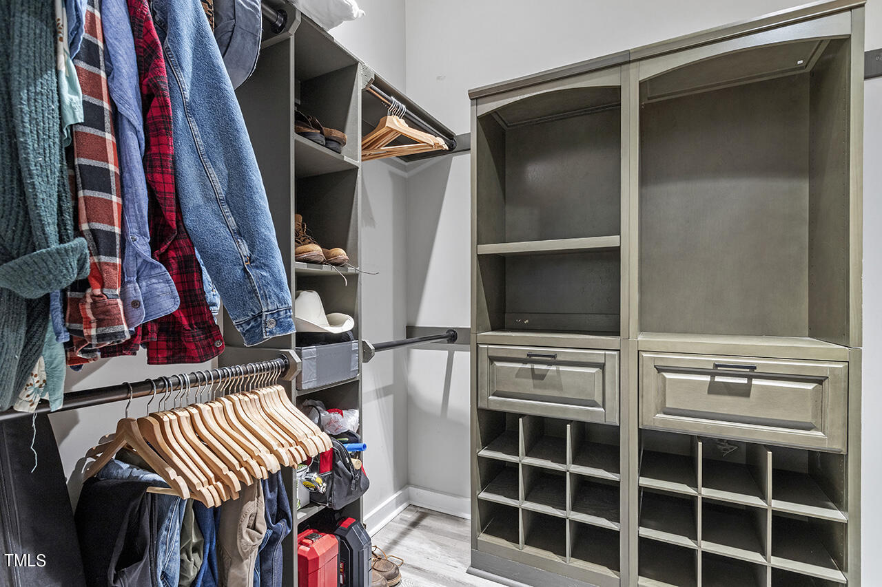 2241 Sheffield Road Raleigh, NC 27610 - Photo 20 of 33 a view of walk in closet with clothes and shoes