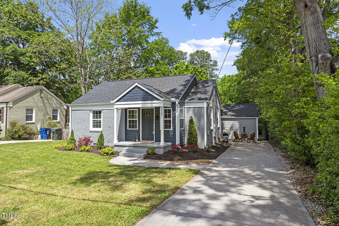 2241 Sheffield Road Raleigh, NC 27610 - Photo 27 of 33 a front view of house with yard outdoor seating and green space
