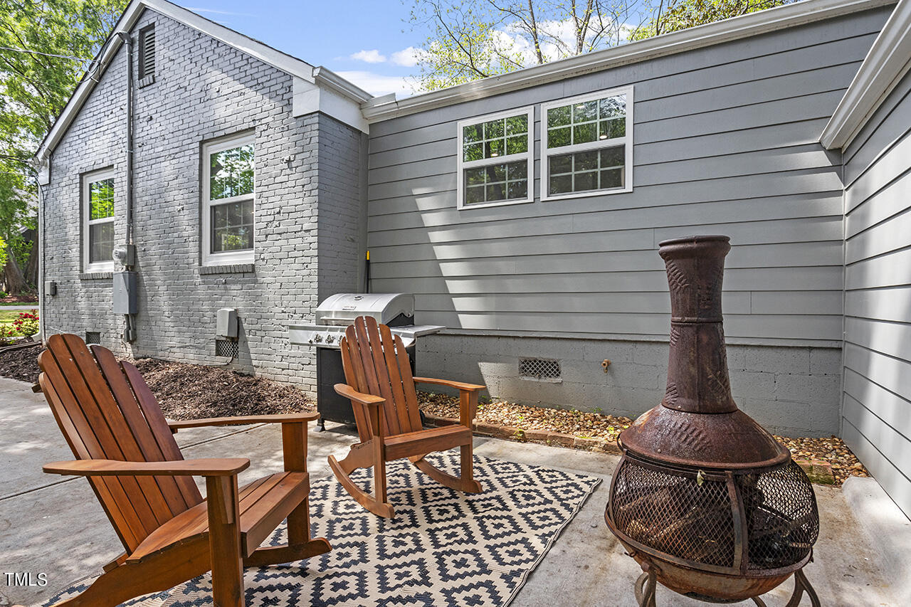 2241 Sheffield Road Raleigh, NC 27610 - Photo 4 of 33 a view of a patio with chair and tables