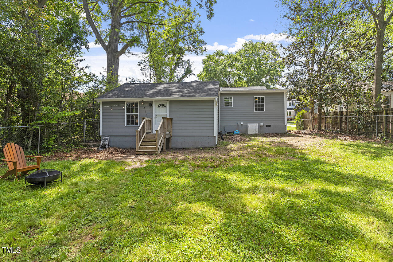 2241 Sheffield Road Raleigh, NC 27610 - Photo 5 of 33 a backyard of a house with seating space