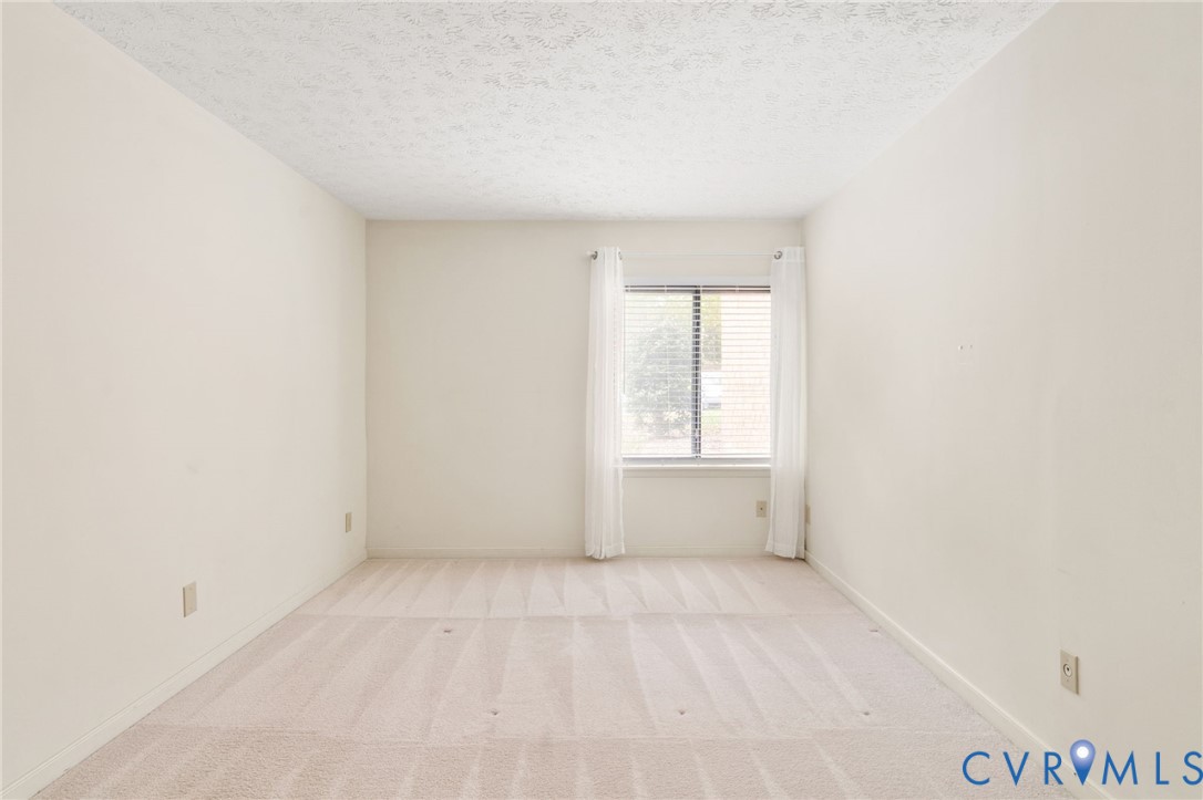 1501 Regency Woods Road, Unit 101 Henrico, VA 23238 - Photo 10 of 29 The primary bedroom features a walk-in closet and