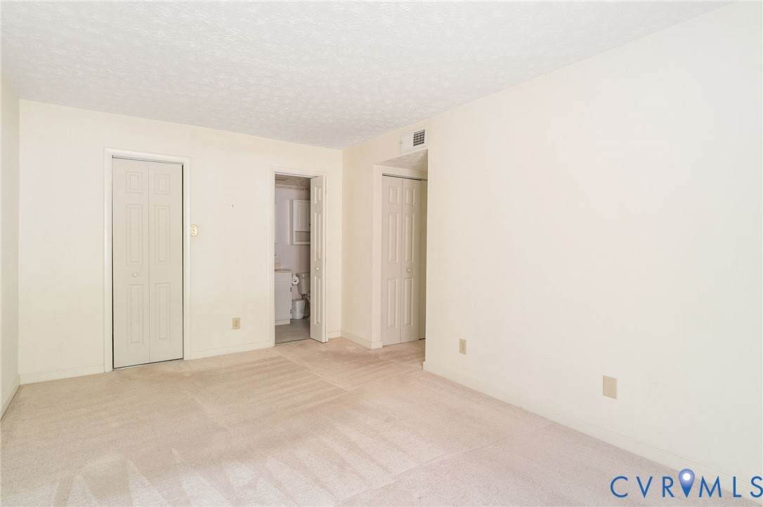1501 Regency Woods Road, Unit 101 Henrico, VA 23238 - Photo 11 of 29 The primary bedroom features a walk-in closet and