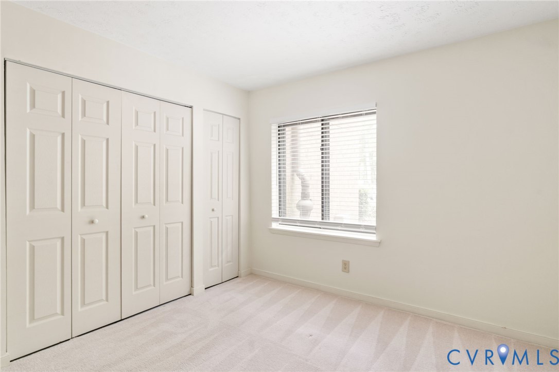 1501 Regency Woods Road, Unit 101 Henrico, VA 23238 - Photo 13 of 29 Bedroom two features two generous closets and has