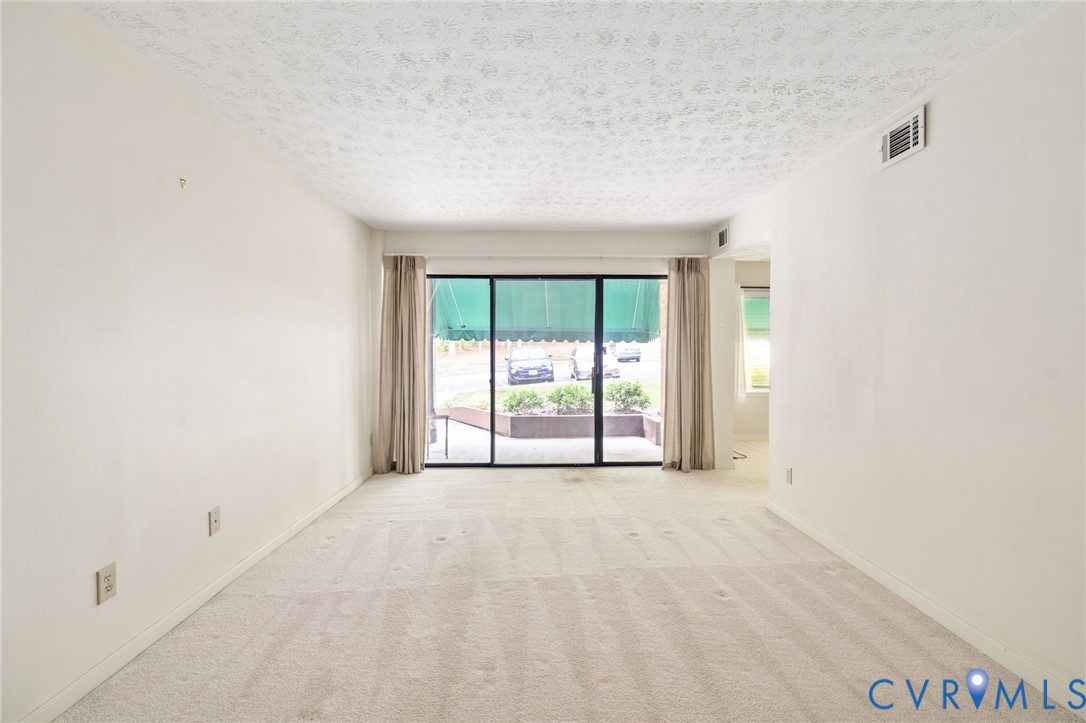 1501 Regency Woods Road, Unit 101 Henrico, VA 23238 - Photo 2 of 29 The spacious family room features a large sliding