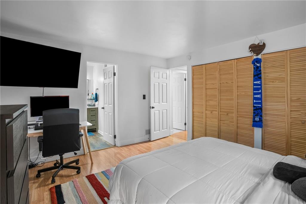 1706 Kenzie Road Pittsburgh, PA 15205 - Photo 13 of 25 a bedroom with a bed and a flat screen tv