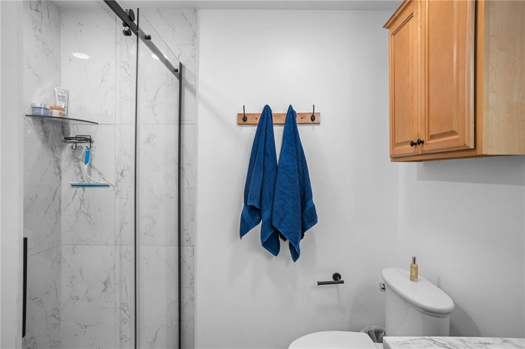 1706 Kenzie Road Pittsburgh, PA 15205 - Photo 15 of 25 a bathroom with a shower a toilet and a sink