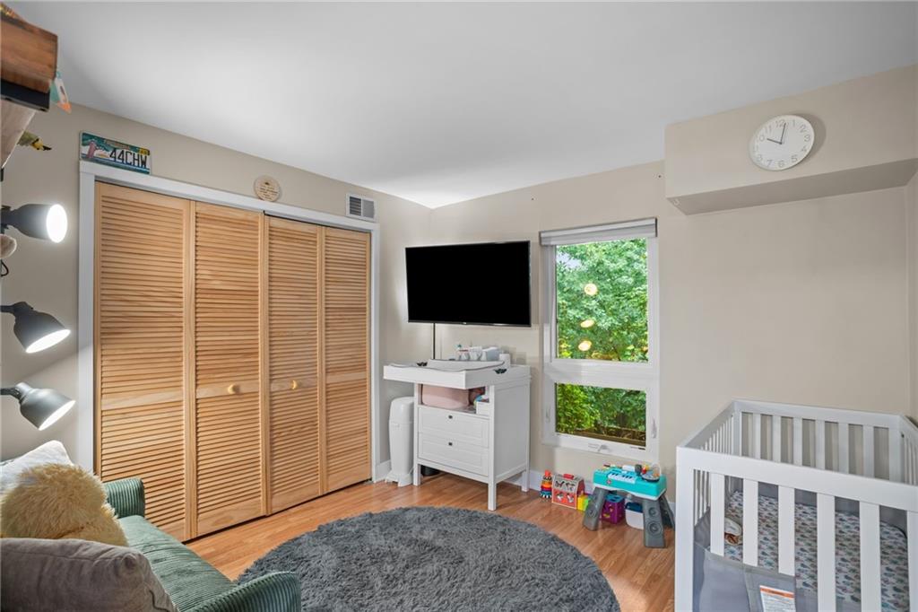 1706 Kenzie Road Pittsburgh, PA 15205 - Photo 16 of 25 a living room with furniture a flat screen tv and a floor to ceiling window