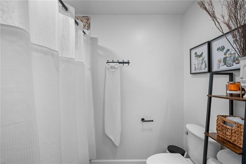 1706 Kenzie Road Pittsburgh, PA 15205 - Photo 20 of 25 a bathroom with a toilet and a shower