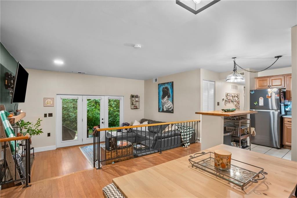 1706 Kenzie Road Pittsburgh, PA 15205 - Photo 3 of 25 a living room with furniture flat screen tv and a large window