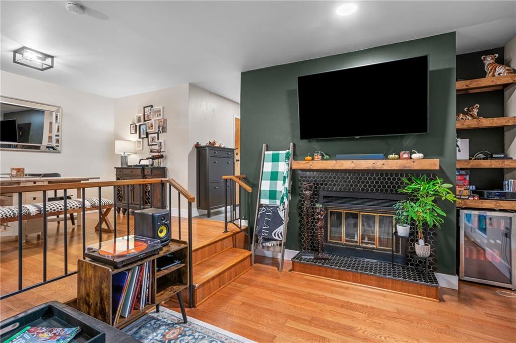 1706 Kenzie Road Pittsburgh, PA 15205 - Photo 5 of 25 a living room with furniture a flat screen tv and a fireplace