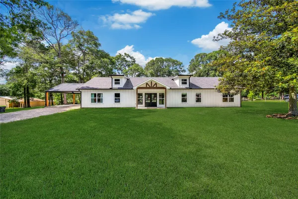 a aerial view of a house with a big yard