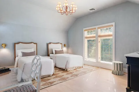 a living room with couch and a large window