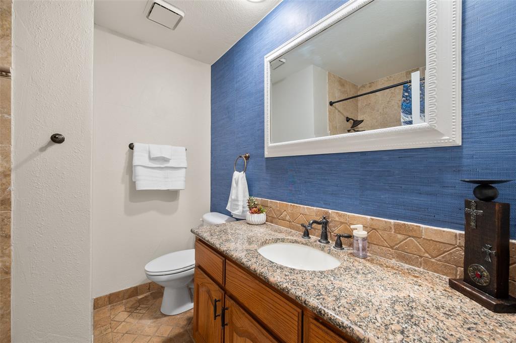 424 Windjammer Lane Azle, TX 76020 - Photo 16 of 37 Full bath featuring decorative backsplash, vanity, and a shower