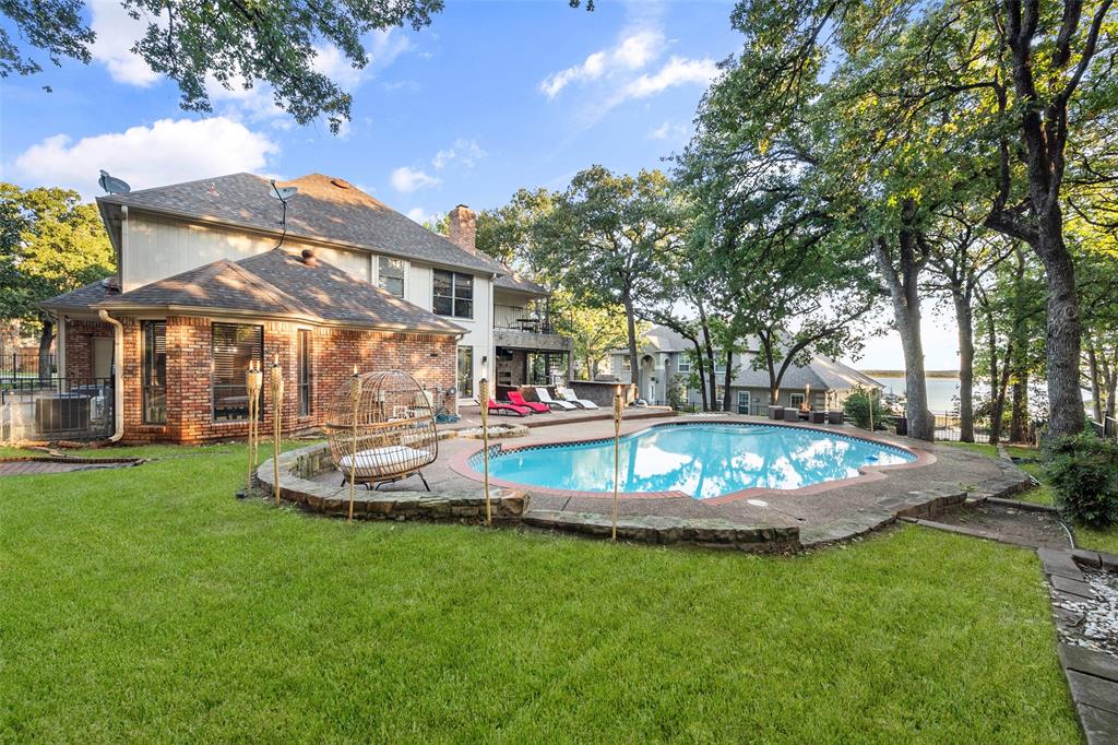 424 Windjammer Lane Azle, TX 76020 - Photo 2 of 37 View of pool with a patio and a balcony