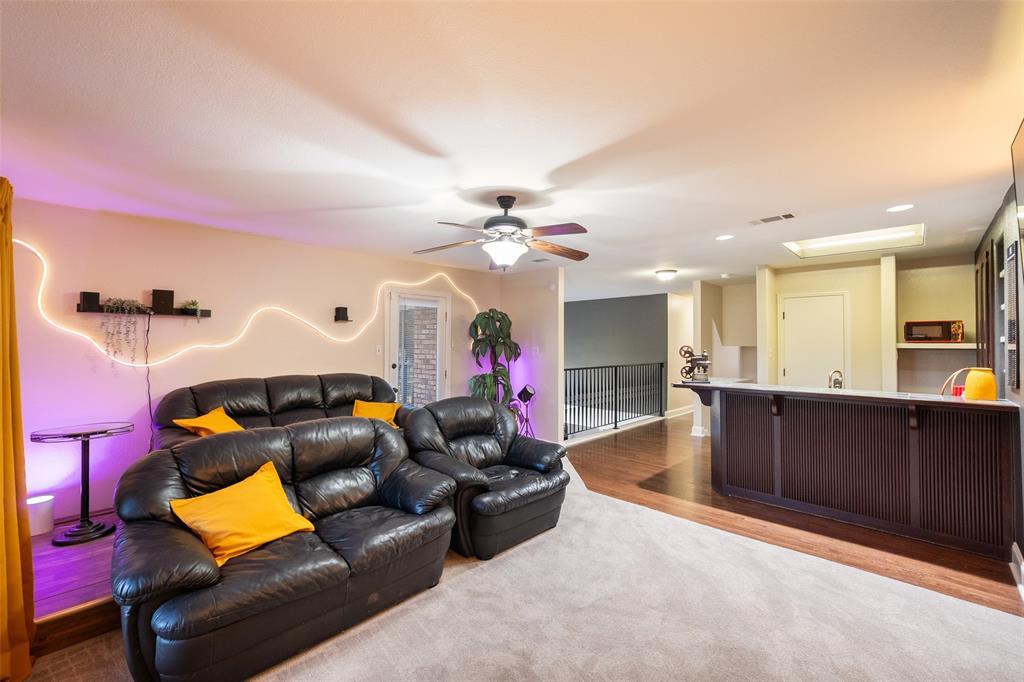 424 Windjammer Lane Azle, TX 76020 - Photo 20 of 37 Carpeted living area featuring wood finished floors, ceiling fan, and recessed lighting