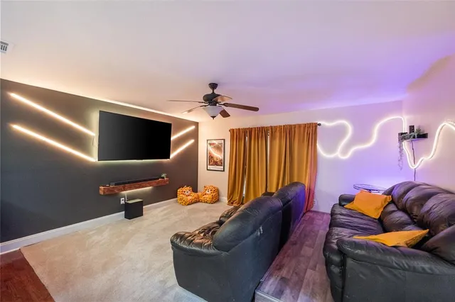 a kitchen with stainless steel appliances granite countertop a sink and a refrigerator