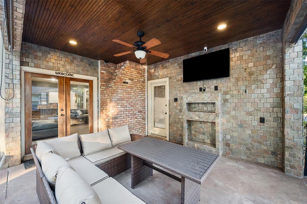 424 Windjammer Lane Azle, TX 76020 - Photo 28 of 37 View of patio / terrace featuring french doors, an outdoor living space with a fireplace, and ceiling fan