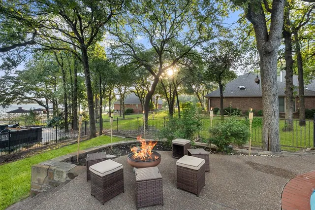a view of a patio with couches and a fire pit