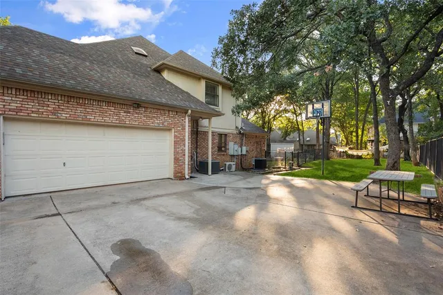 a view of a street with a building and a tree