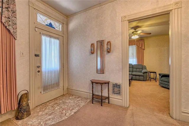 a view of a livingroom with furniture and a window