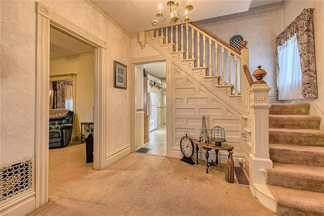 a view of entryway and hall with dining room