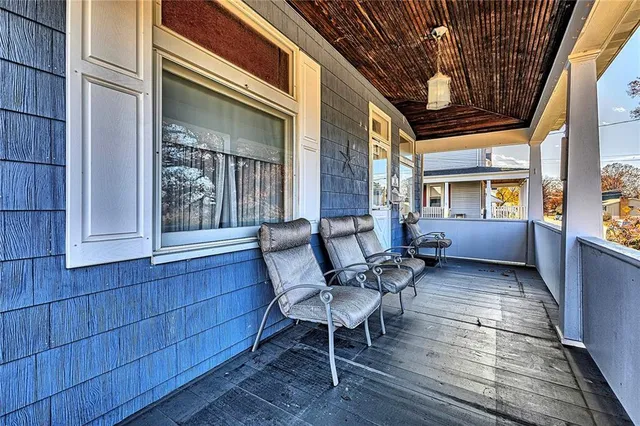 a view of a porch with furniture