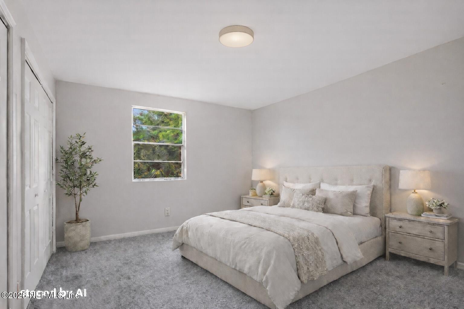 1716 El Camino Road, Unit 6 Jacksonville, FL 32216 - Photo 11 of 18 a bedroom with a bed and a potted plant