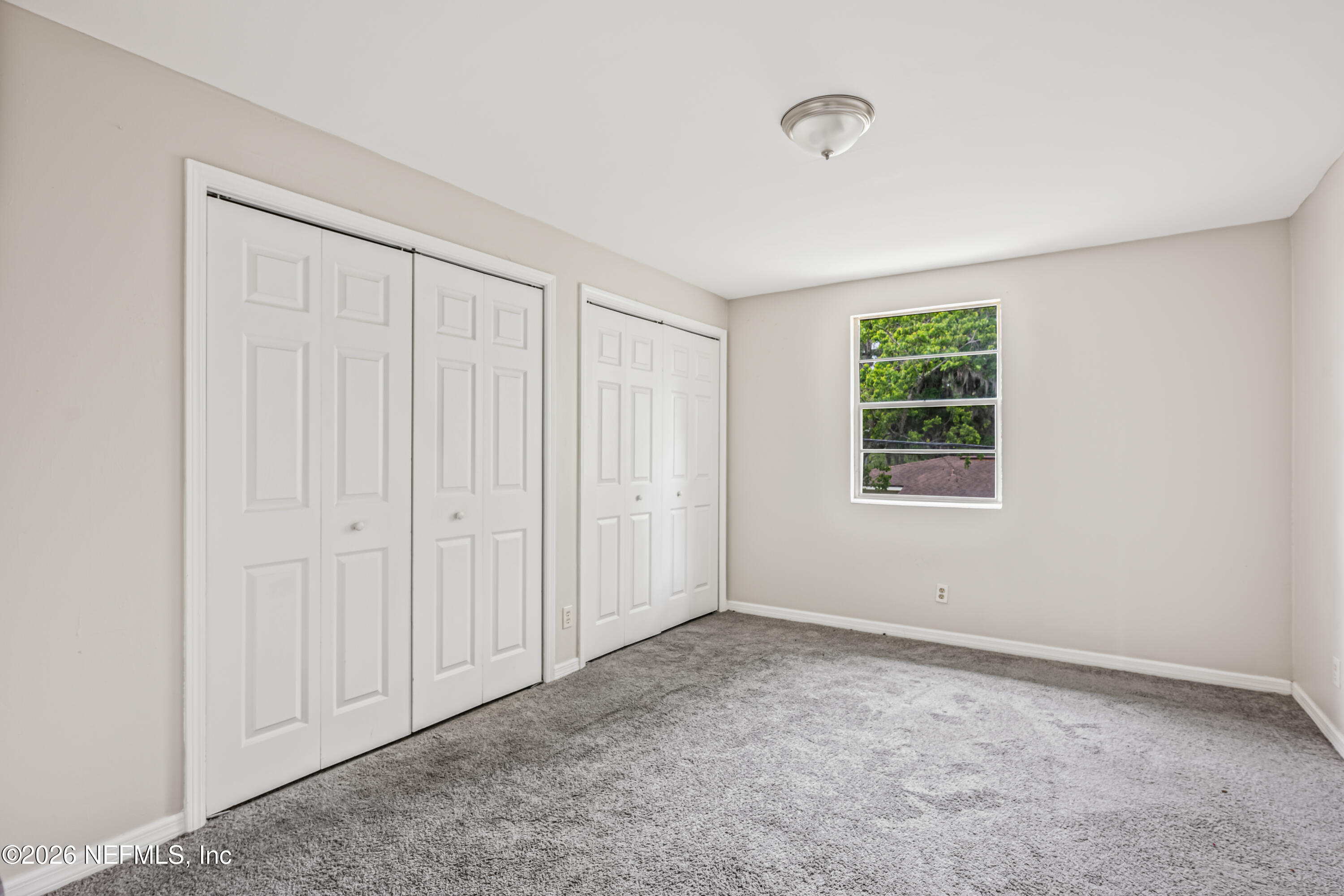 1716 El Camino Road, Unit 6 Jacksonville, FL 32216 - Photo 12 of 18 an empty room with windows