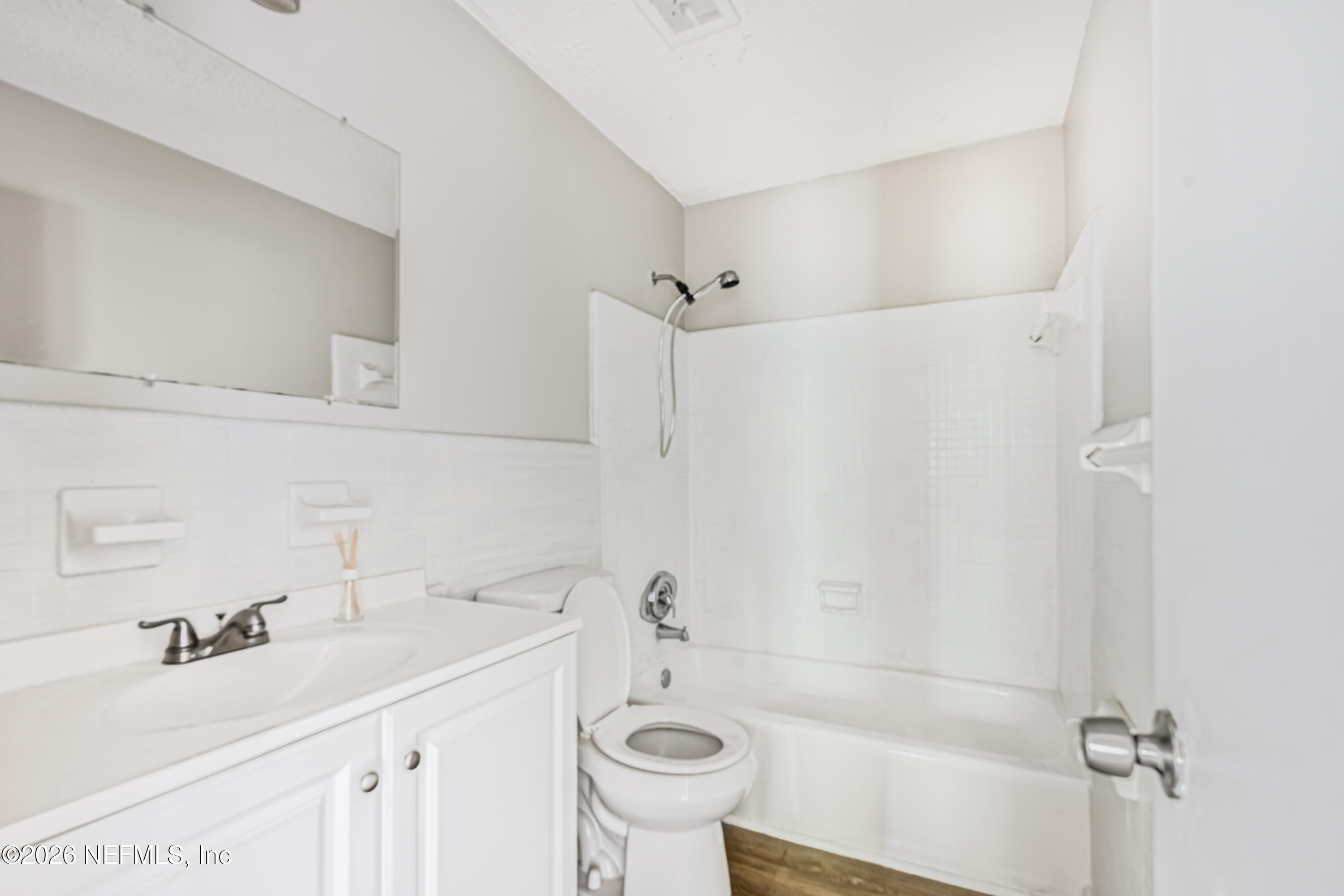 1716 El Camino Road, Unit 6 Jacksonville, FL 32216 - Photo 13 of 18 a bathroom with a sink a toilet and shower