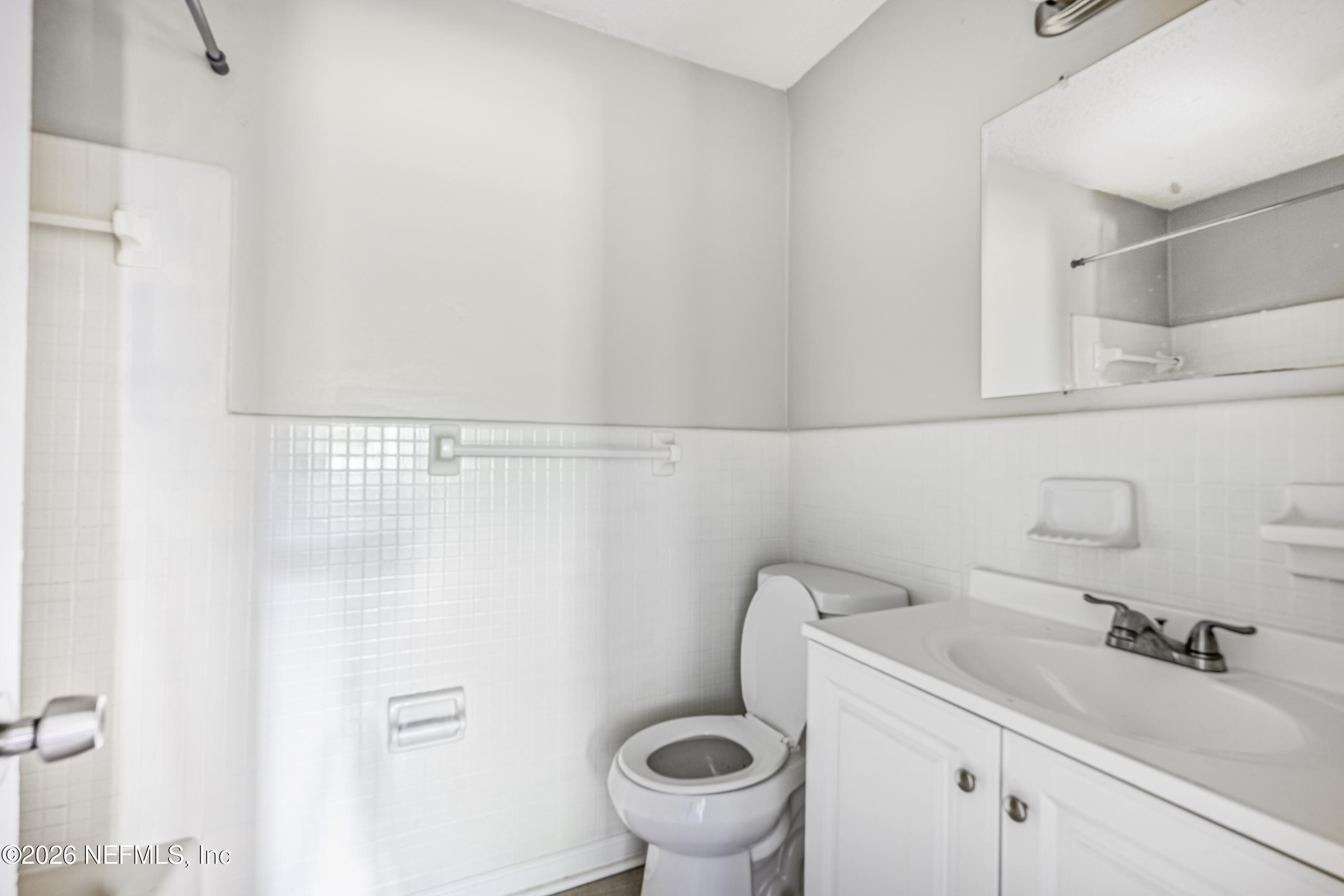 1716 El Camino Road, Unit 6 Jacksonville, FL 32216 - Photo 17 of 18 a bathroom with a sink and a toilet