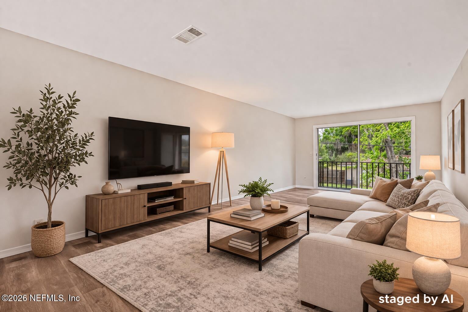 1716 El Camino Road, Unit 6 Jacksonville, FL 32216 - Photo 4 of 18 a living room with furniture and a flat screen tv