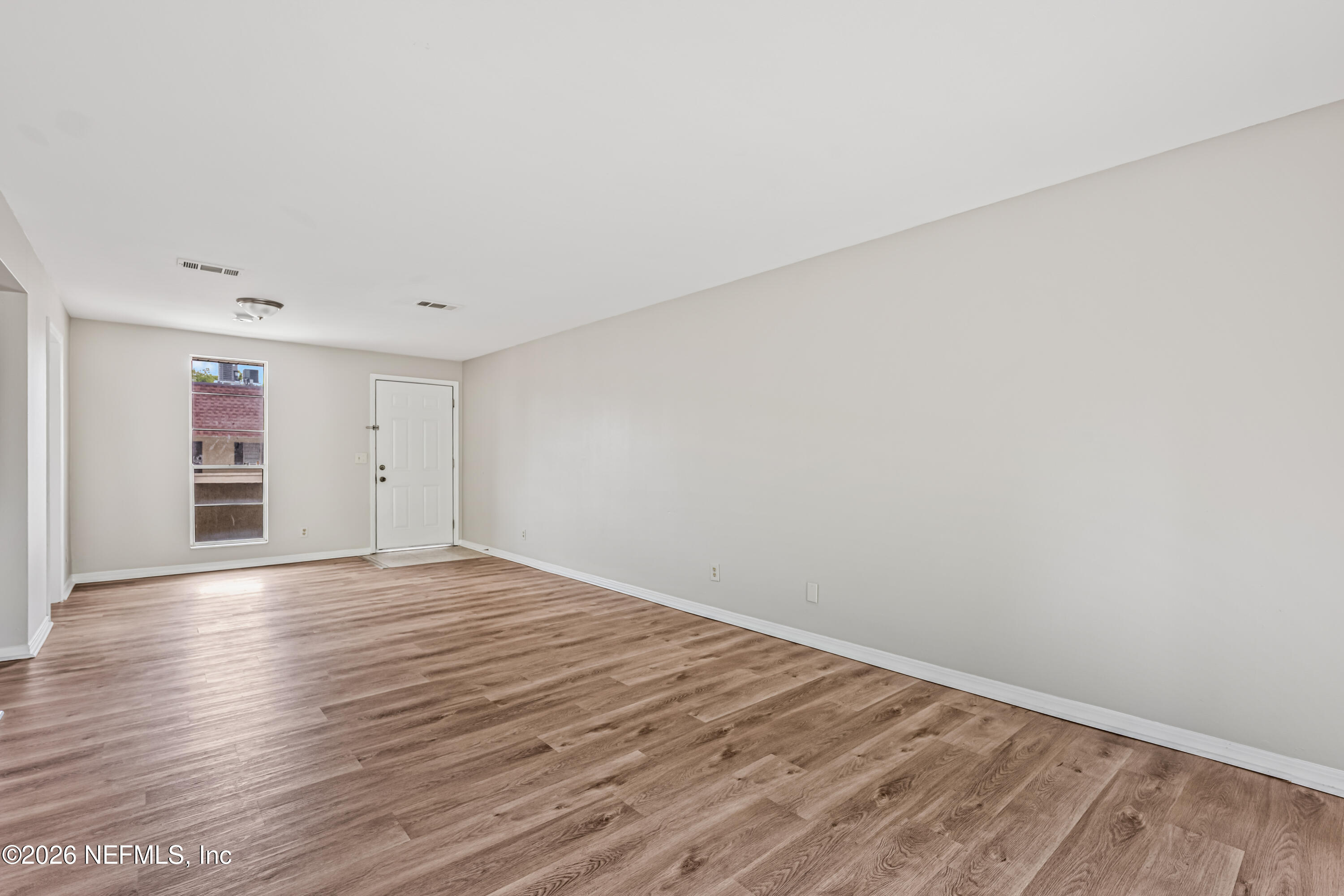 1716 El Camino Road, Unit 6 Jacksonville, FL 32216 - Photo 5 of 18 a view of empty room with wooden floor