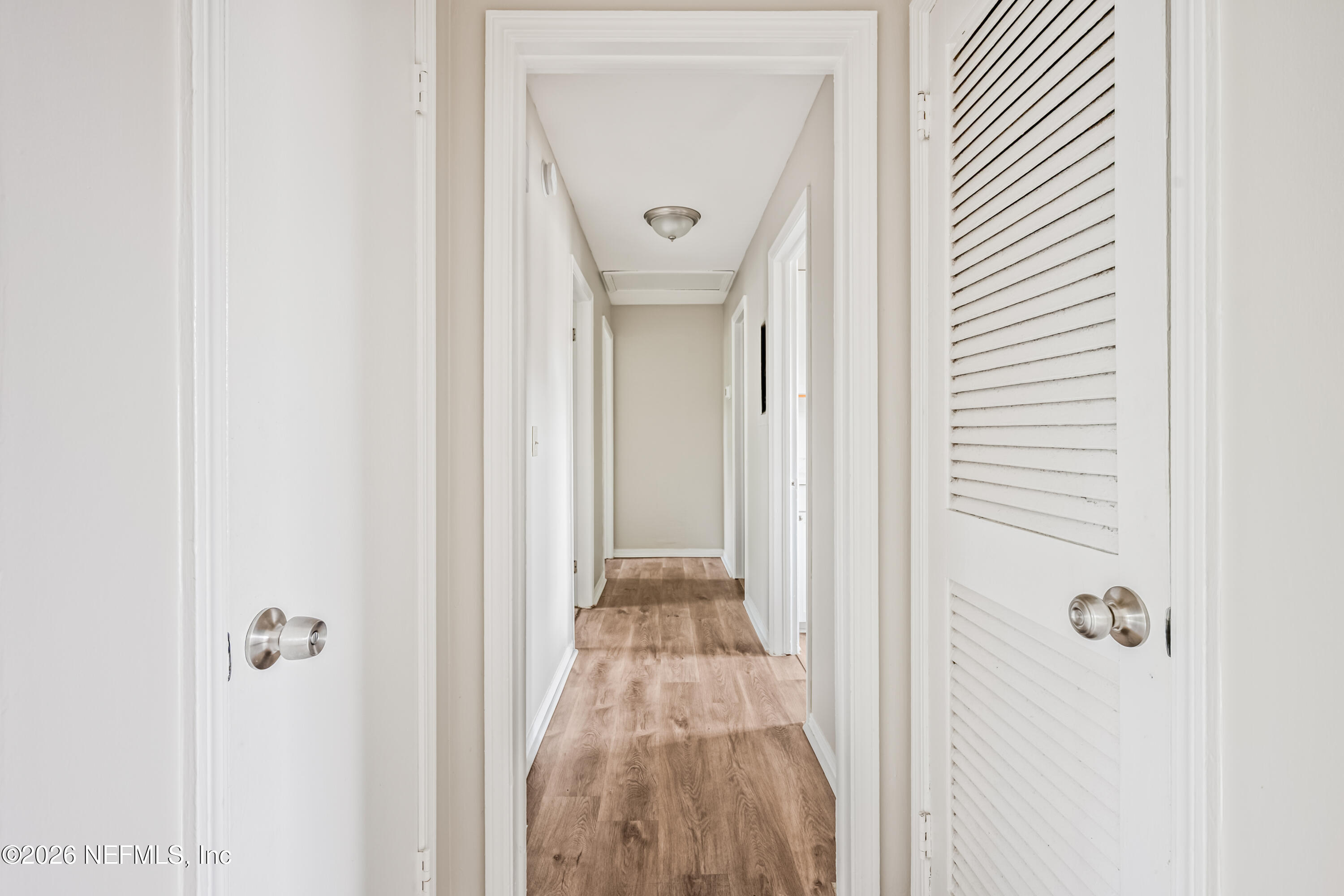 1716 El Camino Road, Unit 6 Jacksonville, FL 32216 - Photo 9 of 18 a view of a hallway with wooden floor
