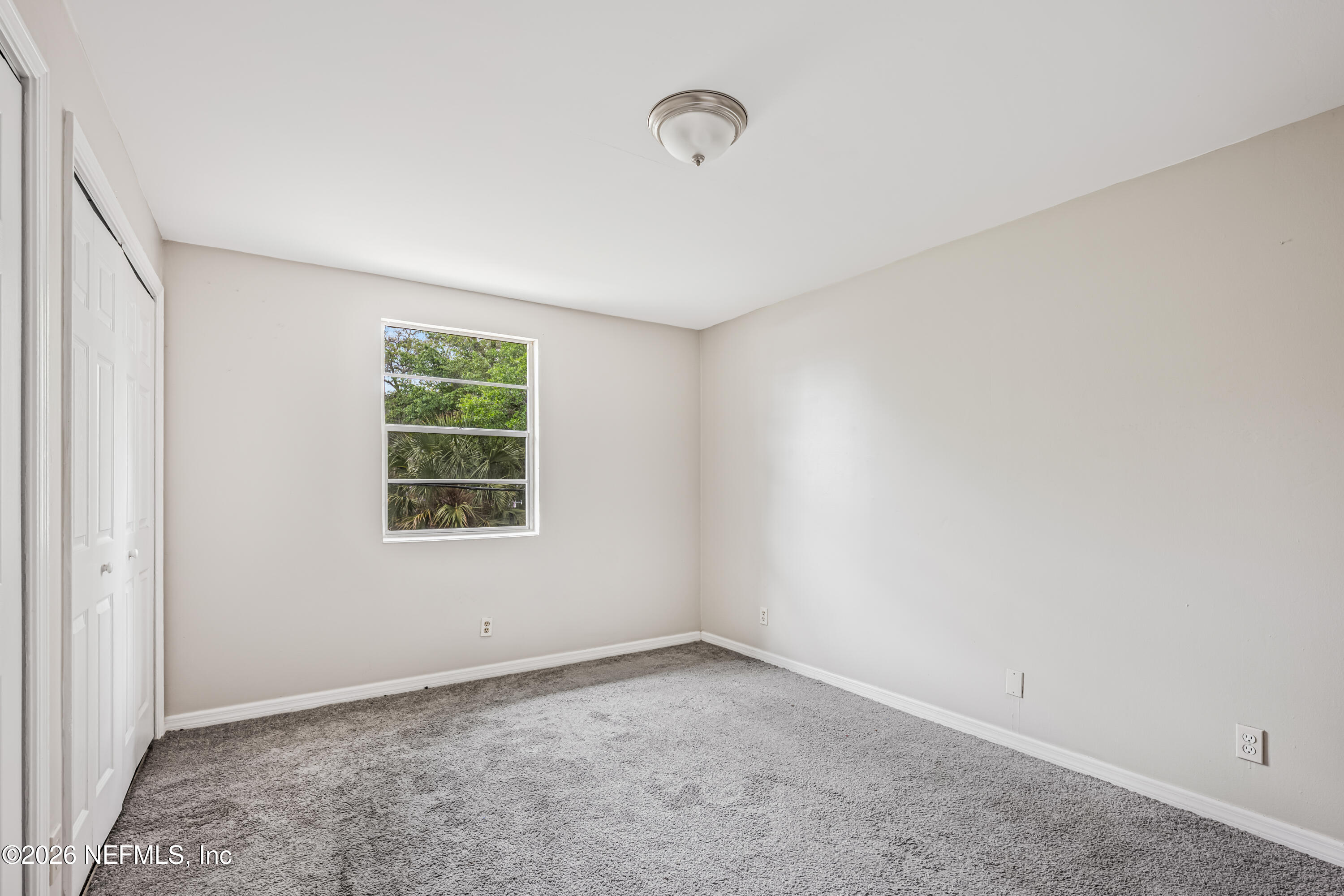 1716 El Camino Road, Unit 6 Jacksonville, FL 32216 - Photo 10 of 18 an empty room with a window